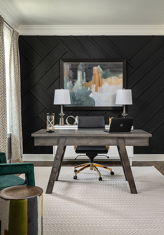 This up-to-date home office uses paint to the max with the black back wall!